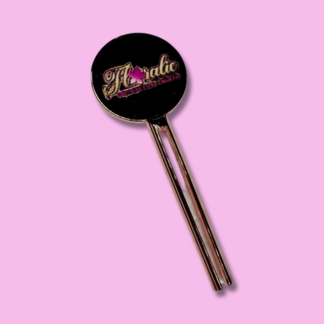 Clé en métal – Rouleur de tubes (or rose)